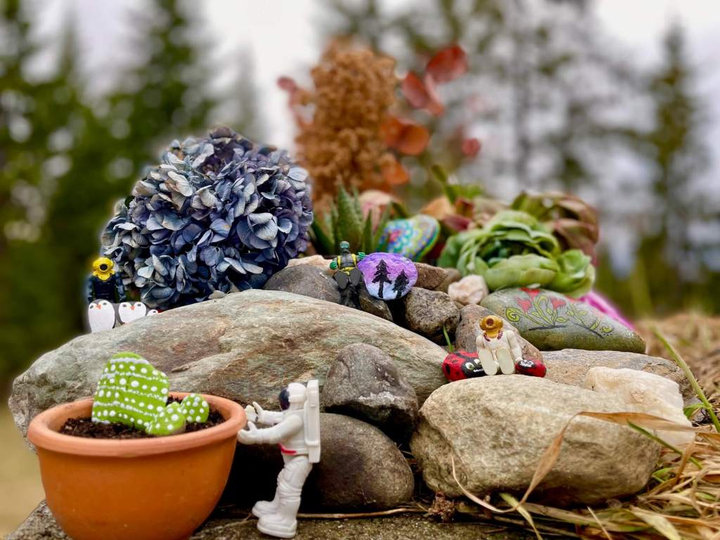 Small toys displaying the Remembering Rocks they made
