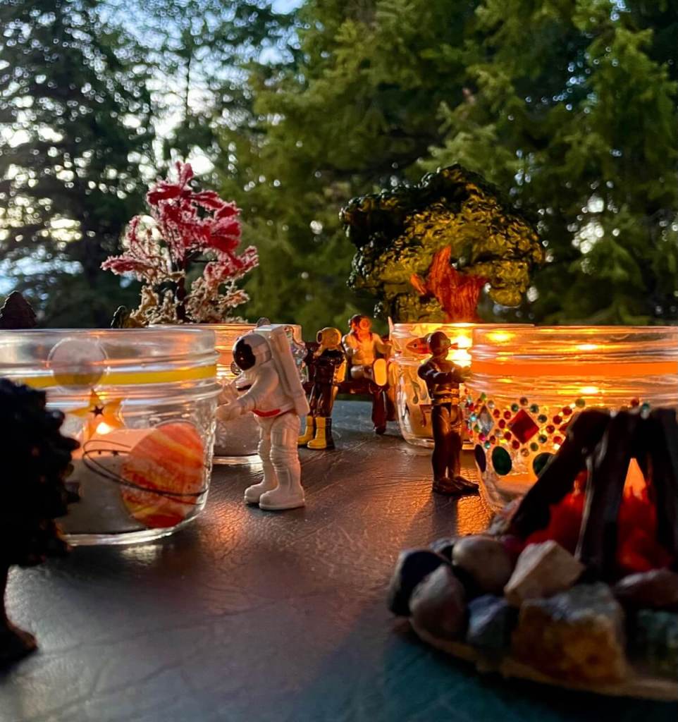 Small toys looking at the Memory Lanterns they made