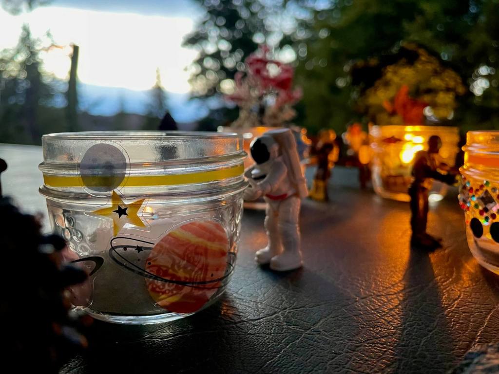 Small toy with a space themed Memory Lantern