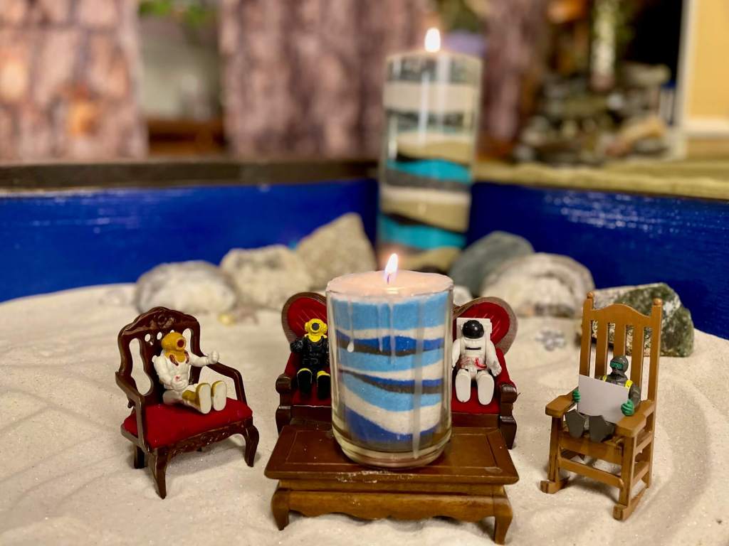 Small toys sitting around the Layers of Love they created