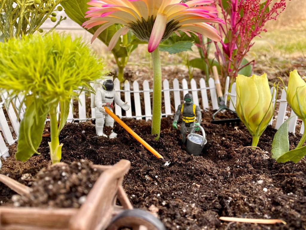 Close up of toys talking and gardening
