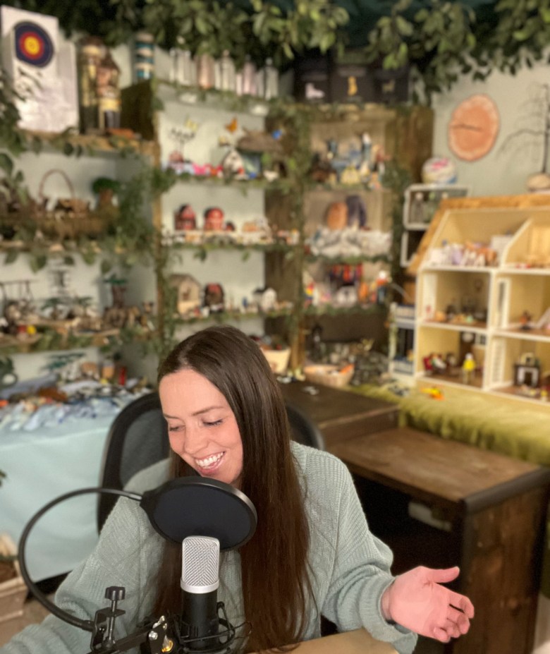 Dallas Shirley talking into a microphone introducing herself